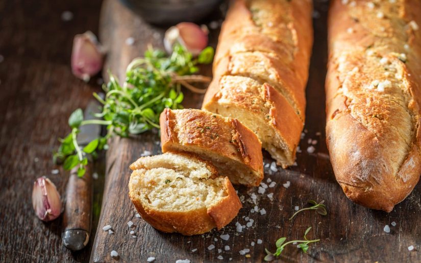 Homemade garlic bread with salt. Baguette with garlic. Italian cuisine.